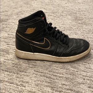 Black and gold air Jordan retro’s
